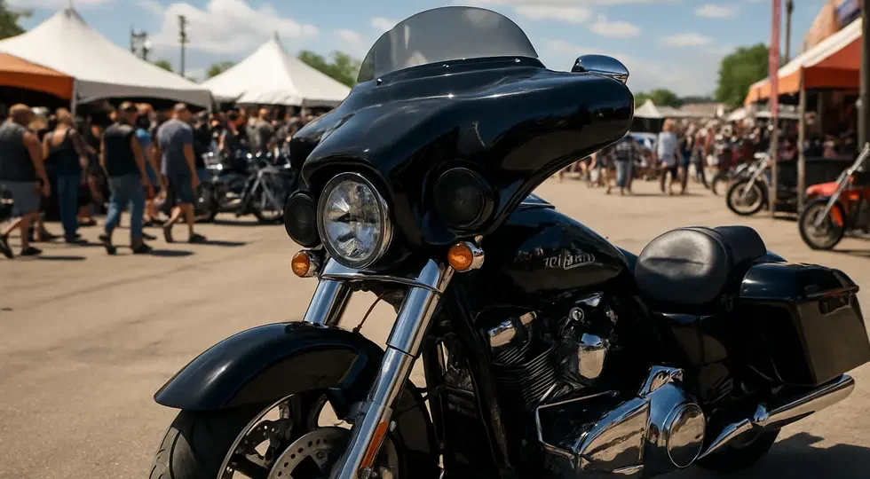 Harley-Davidson motorcycle featuring a Hoppe Industries audio fairing showcased at a major motorcycle event, highlighting design and community impact.