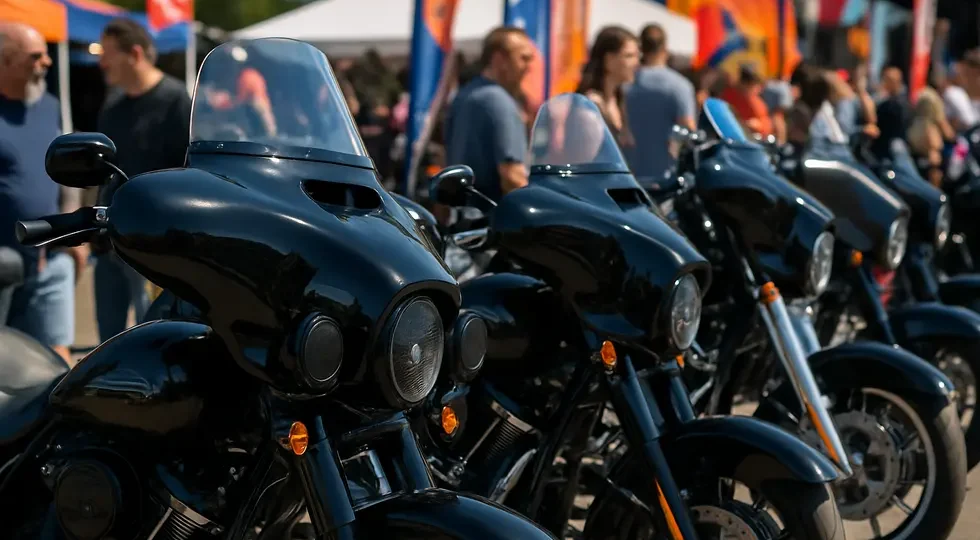 Display of Harley-Davidson motorcycles outfitted with Hoppe fairings at a major motorcycle event, emphasizing style and technology.