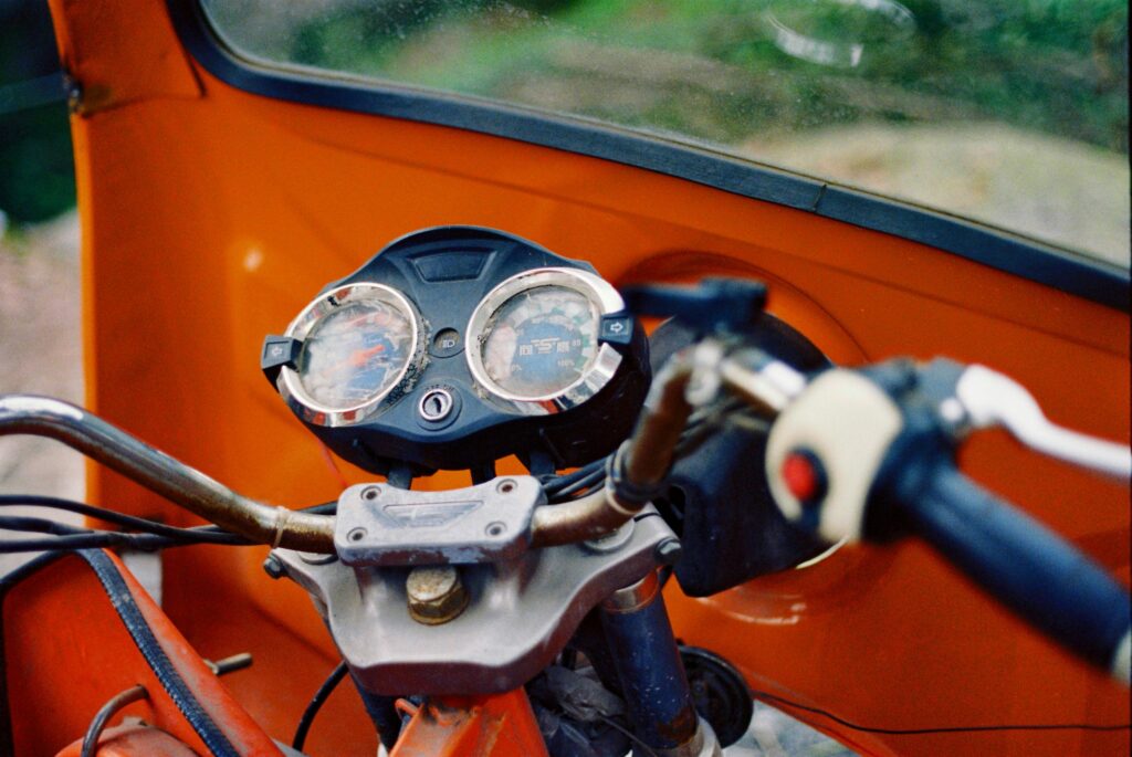 blue and black motorcycle speedometer