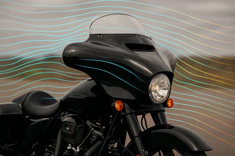 A Harley-Davidson motorcycle featuring a sleek fiberglass fairing with aerodynamic airflow visualization.