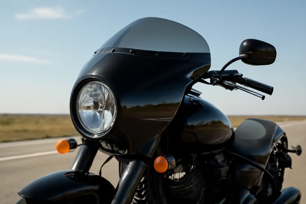 A glossy black bullet fairing showcasing its aerodynamic design fitted on a cruiser motorcycle.