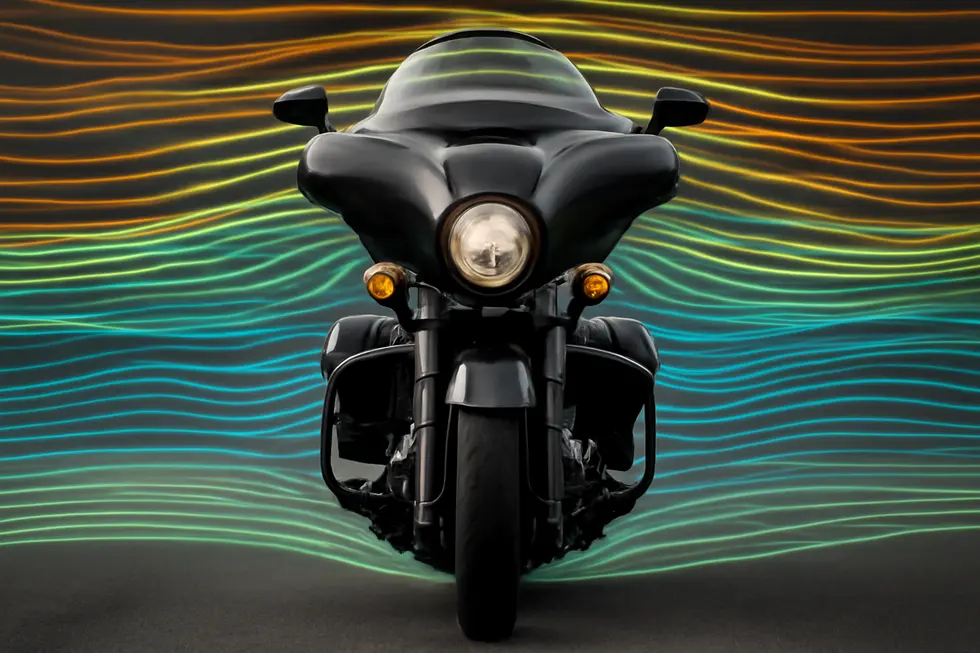 Front view of a motorcycle featuring a centrally aligned fairing with visible airflow streamlines illustrating aerodynamic symmetry.