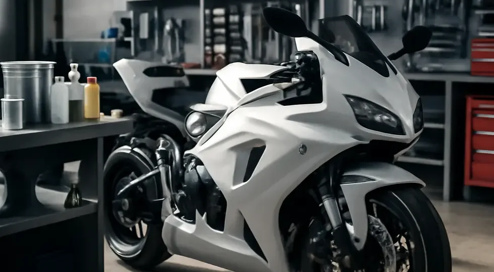 Custom-painted motorcycle showcasing a durable, glossy pearl finish on fairings within a professional workshop setting.