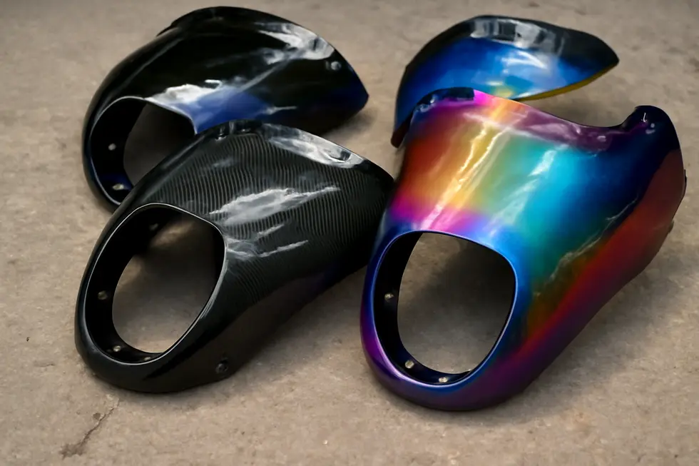 Close-up display of ABS plastic, fiberglass, and carbon fiber materials used in cruiser motorcycle fairings.