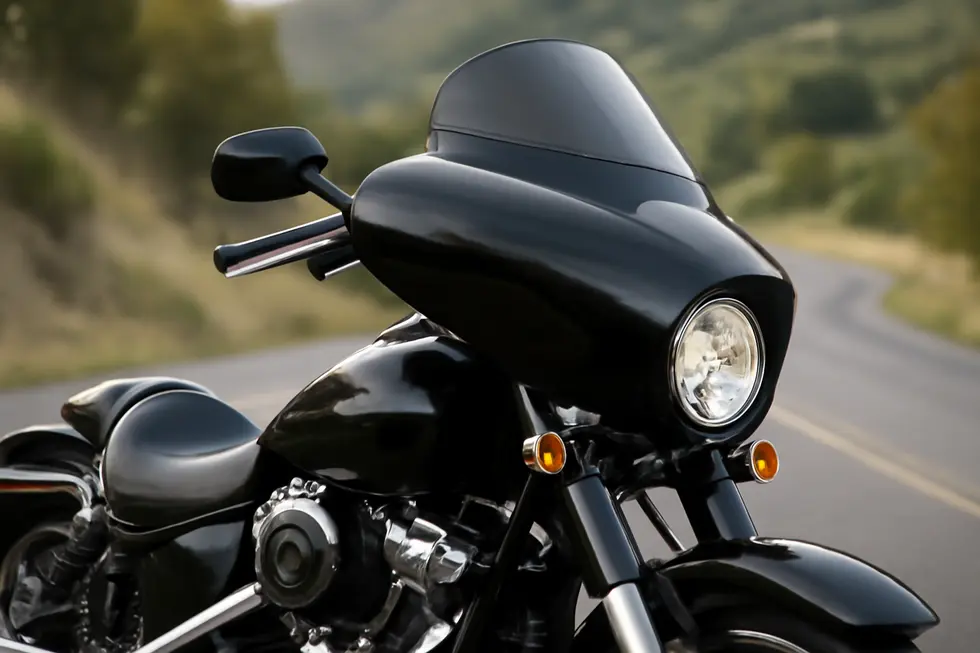 Aerodynamic contours of a classic bullet fairing optimized for wind deflection on a cruiser motorcycle.