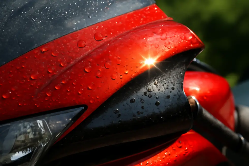 Glossy motorcycle fairing demonstrating superior weather resistance and durable paint finish.