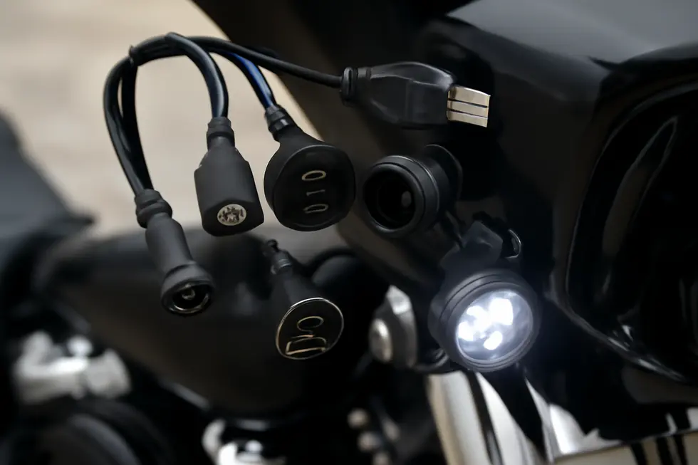 Close-up of the factory USB cable showcasing OEM design and connector details for Harley-Davidson Batwing fairings.