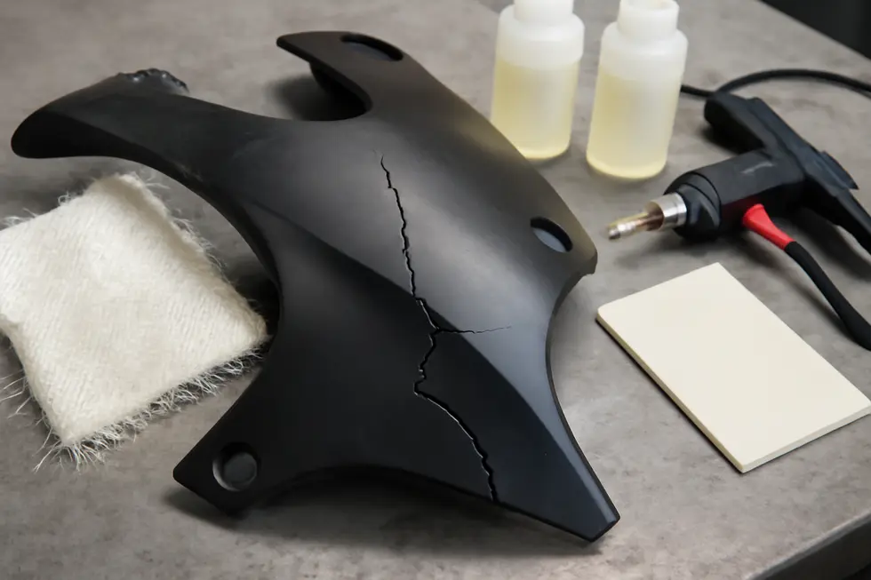 Comparing fiberglass and plastic materials used in motorcycle fairing repairs.