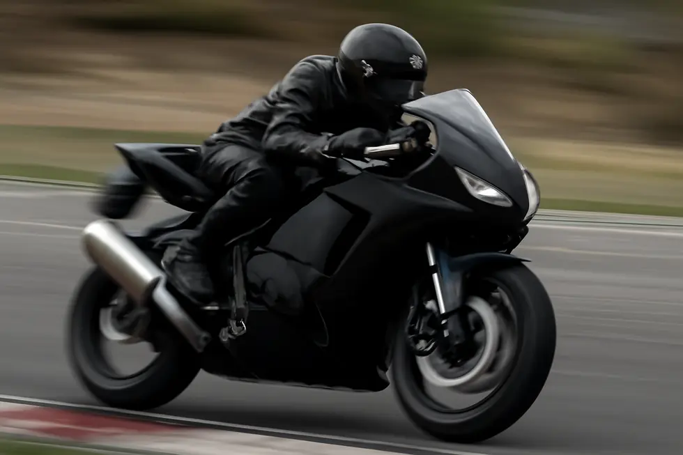 Detailed view of motorcycle fairing components displaying material variety and precision design features.