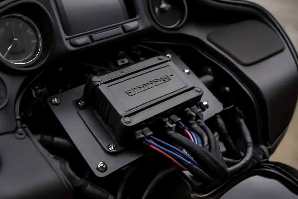 Custom Hertz amplifier securely installed inside a 2024 Road Glide motorcycle fairing, demonstrating clean wiring and tailored fitment.