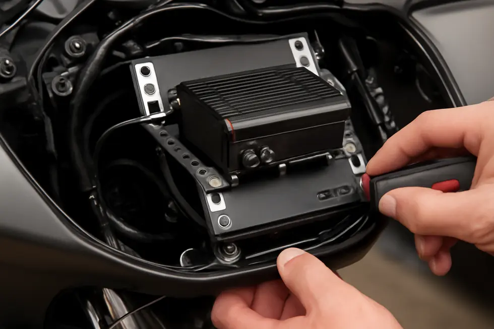 A compact, weather-resistant amplifier flawlessly integrated into a motorcycle fairing, showcasing durability and design.