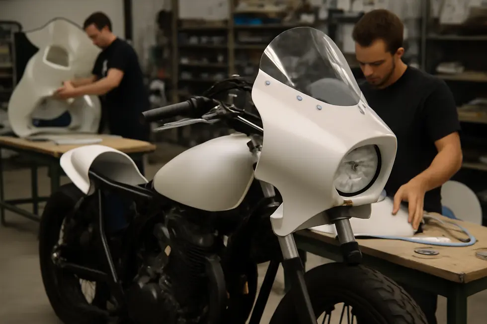 Prototype fairing parts with design sketches and raw materials showcasing essential stages of custom fairing fabrication.