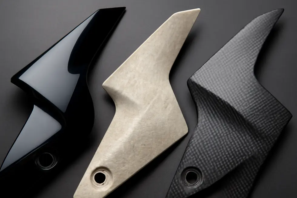 A diverse display of motorcycle fairings including full kits, individual parts, and custom-painted options available on eBay.