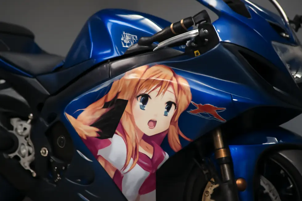 Close-up of an ABS plastic anime motorcycle fairing showcasing advanced decal application and durable glossy finish.