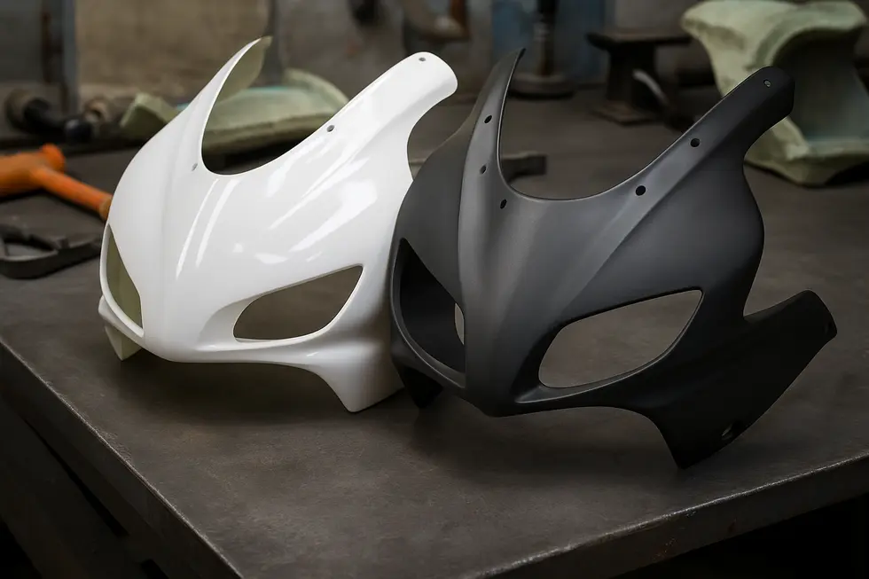 Comparative materials of fiberglass and ABS plastic showcased in a workshop setting highlight manufacturing aspects.
