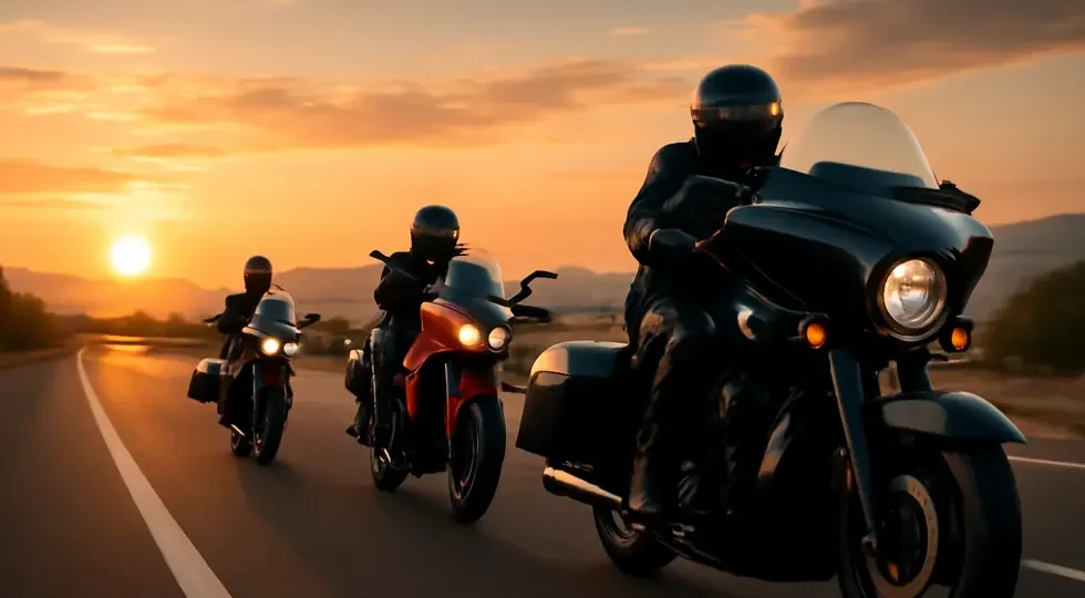 Motorcycles equipped with diverse windshield fairings cruising a scenic highway at sunset, highlighting style and function.