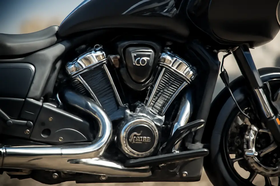 Indian motorcycle fixed fairing improving rider comfort and aerodynamic efficiency on a highway.