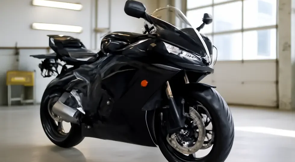 Sport motorcycle showcasing perfectly repaired and installed fairing panels in a professional workshop.