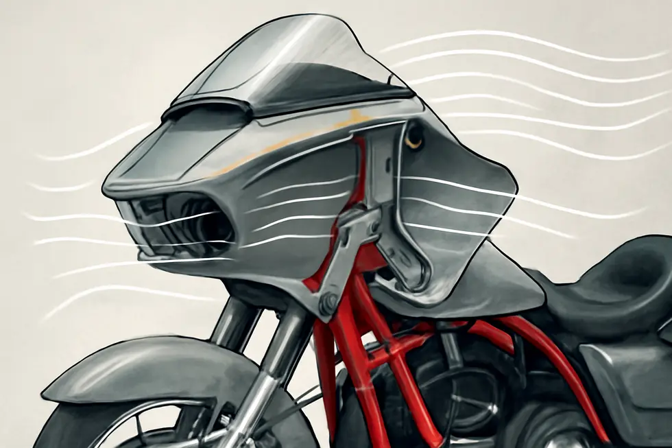 The Harley-Davidson Road Glide showcasing its pioneering sharknose fixed fairing design against a natural landscape.