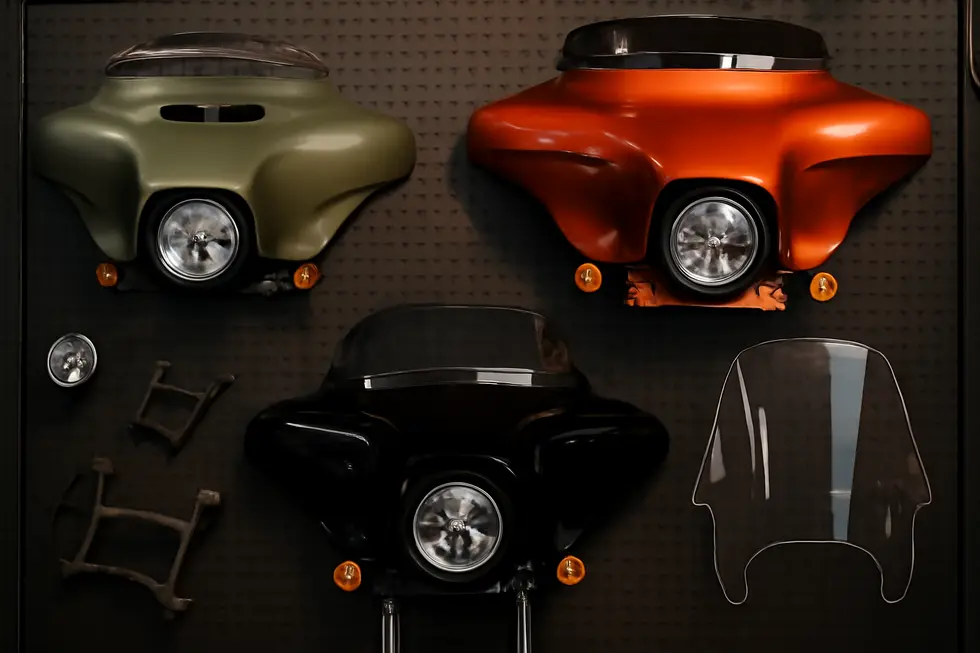A detailed display of core motorcycle fairing kit components showcasing materials and finishes.
