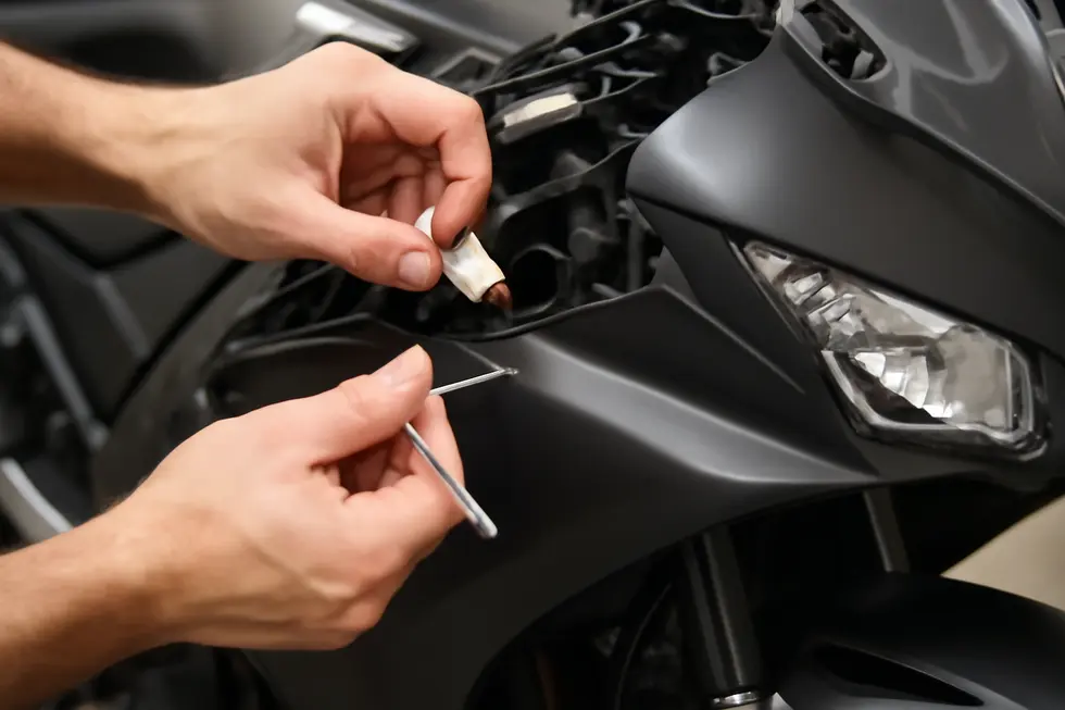 A well-organized mechanic’s workstation showcasing essential tools and a stable motorcycle prepared for safe fairing removal.