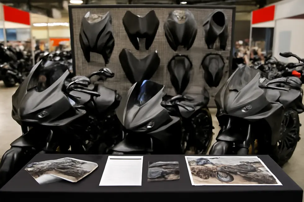 Angular, carbon fiber Mad Max-style fairing emphasizing rugged design and durable materials.