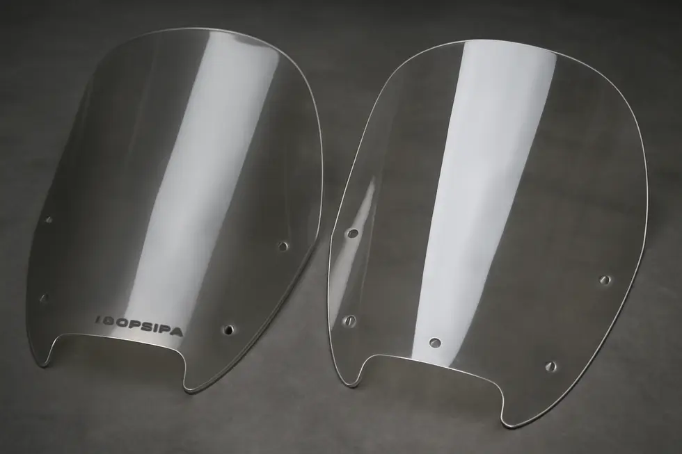 Different types of motorcycle windshields ready for selection.