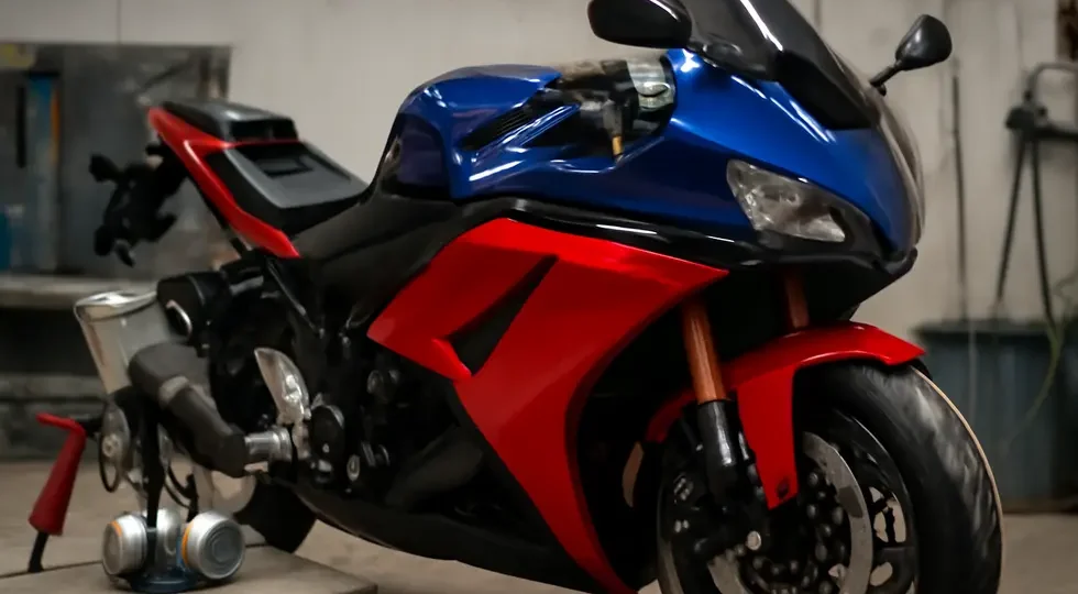 A professionally painted motorcycle with vibrant, glossy fairings showcasing expert preparation and finishing.