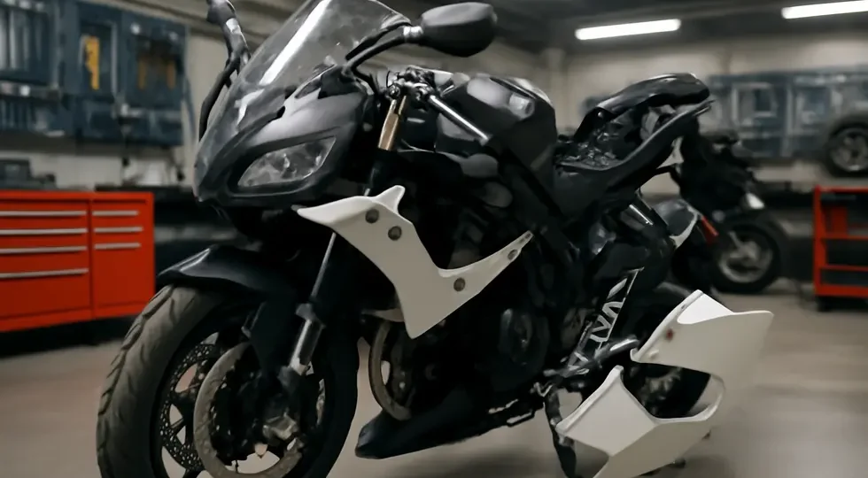 A motorcycle showcasing the versatility and convenience of quick release clips amid a professional workshop environment.