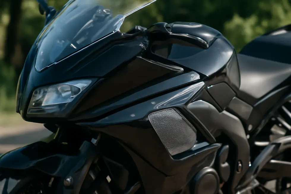 Technicians molding durable ABS and fiberglass fairing covers ensuring precise fitment and strength.