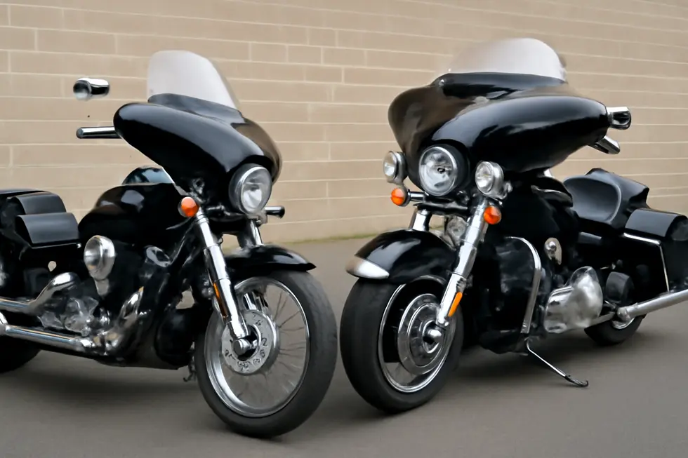 Classic cruiser motorcycle showcasing the iconic batwing fairing design and functional windshield on an open road.