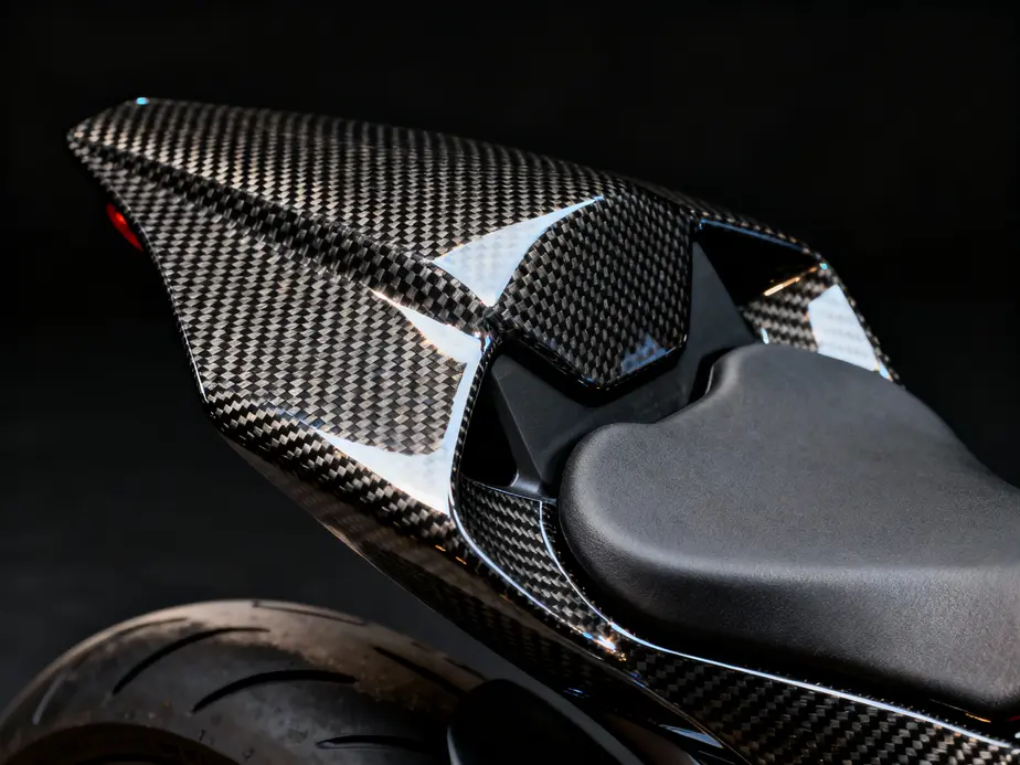 A motorcycle with carbon fiber fairings demonstrating advanced aerodynamics and weight reduction.