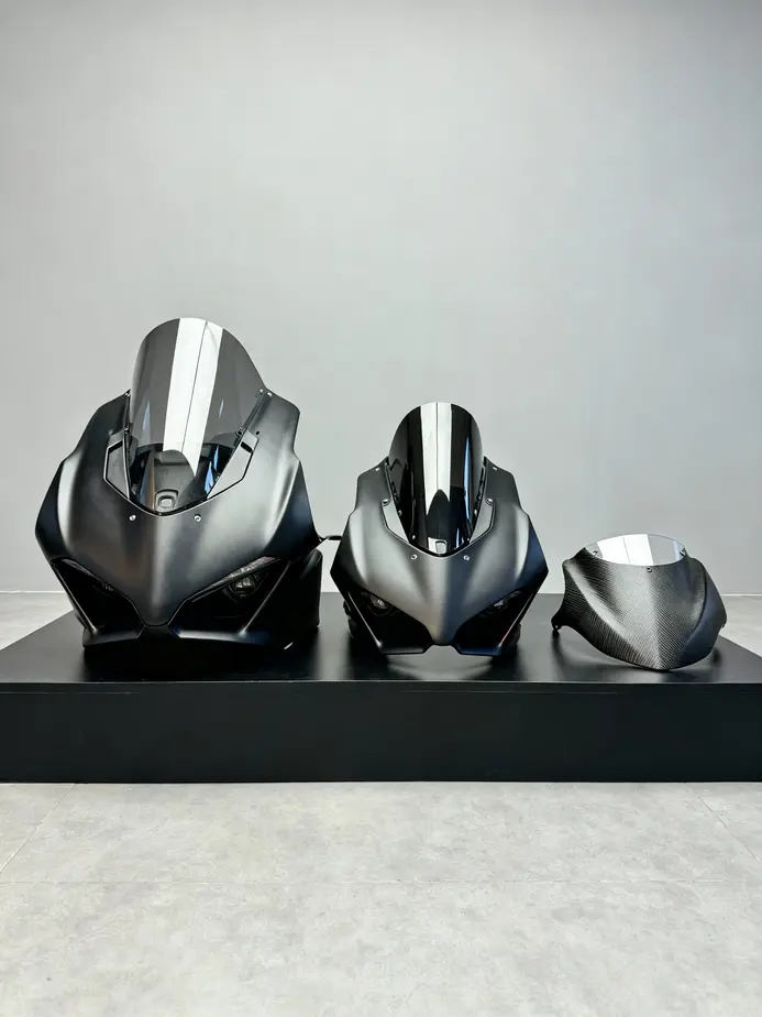 Close-up of motorcycle front fairing illustrating its role in airflow management and wind protection.